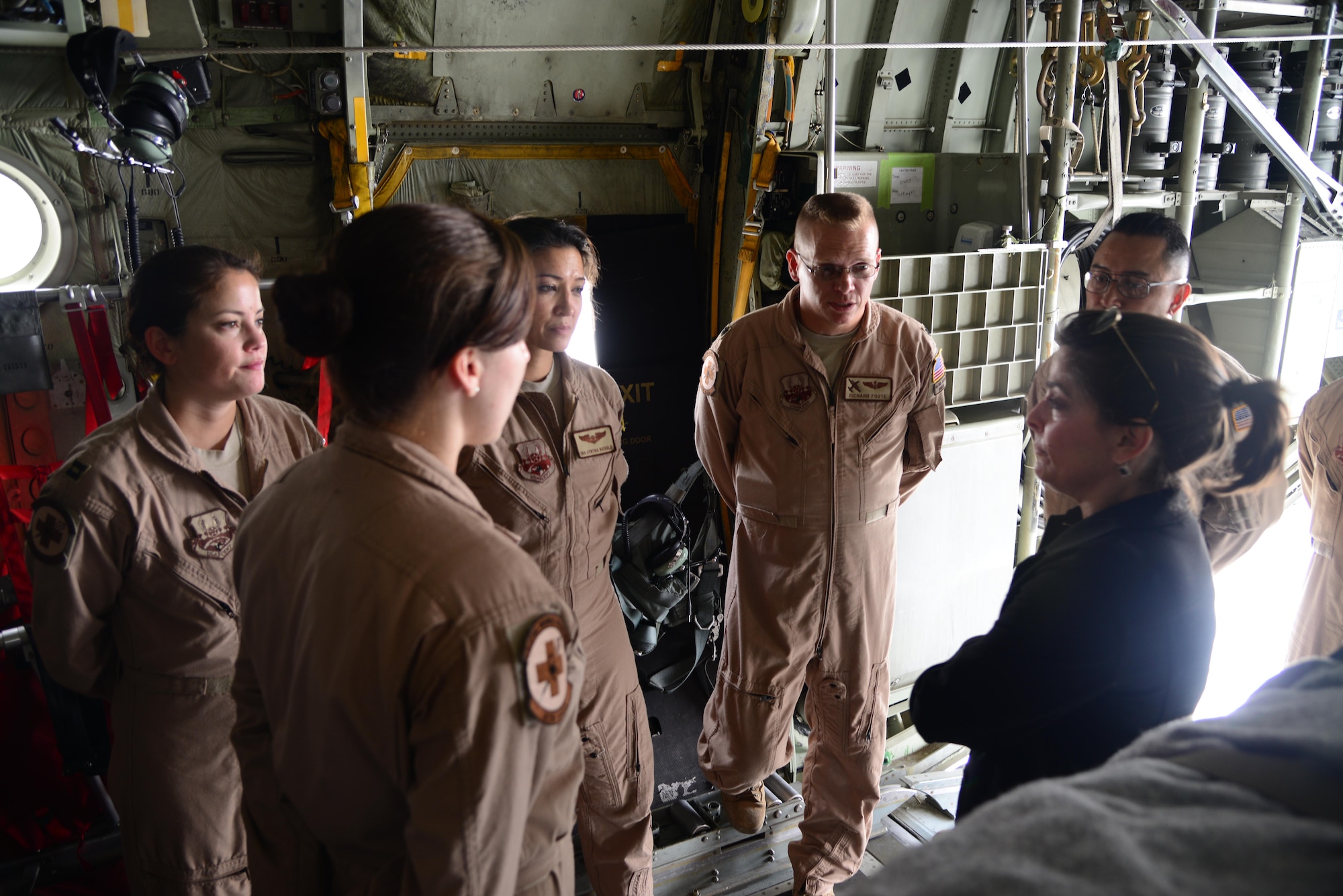 Airmen from the 379th Expeditionary Aeromedical Evacuation Squadron briefs U.S. Ambassador Dana Shell Smith on their duties of transporting wounded warriors to better echelons of care April 27, 2015 at Al Udeid Air Base, Qatar. Smith toured the facilities of AUAB as well as different jets on the flight line.  (U.S. Air Force photo/Tech. Sgt. Rasheen Douglas)