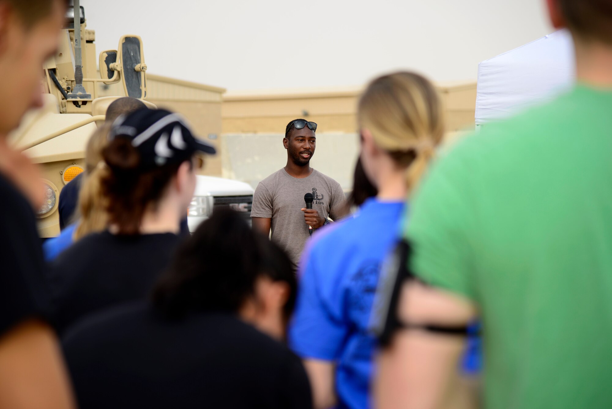 U.S. Air Force Staff Sgt. John Mitchell, a 386th Civil Engineer Squadron explosive ordnance disposal journeyman, gives opening comments during a memorial challenge at an undisclosed location in Southwest Asia May 2, 2015. The EOD Memorial Wall, located at Eglin Air Force Base in Florida, recognizes the sacrifices of the fallen warriors and their families dating back to World War II. (U.S. Air Force photo by Senior Airman Racheal E. Watson/Released)