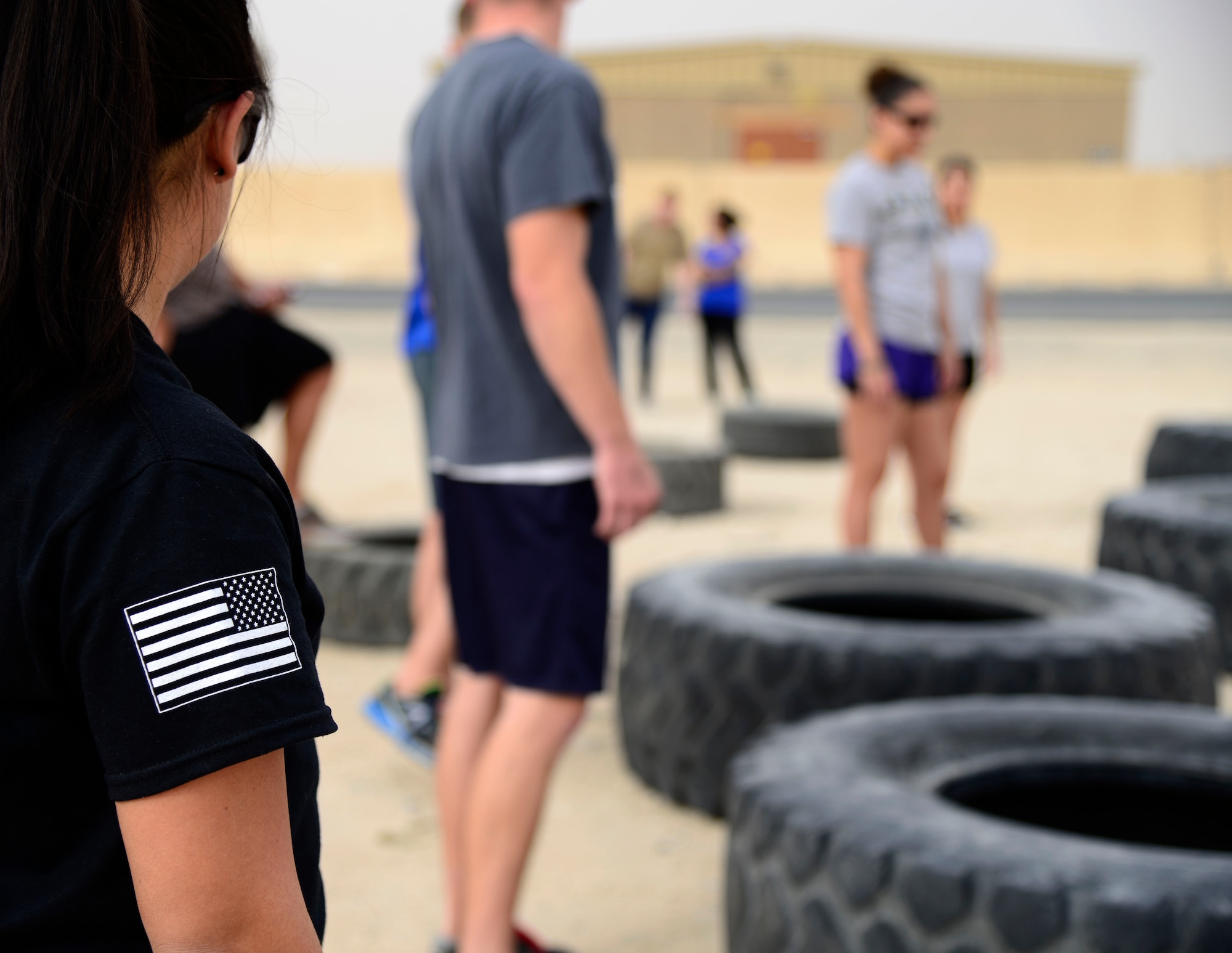 U.S. Air Force Staff Sgt. John Mitchell, a 386th Civil Engineer Squadron explosive ordnance disposal journeyman, gives opening comments during a memorial challenge at an undisclosed location in Southwest Asia May 2, 2015. The EOD Memorial Wall, located at Eglin Air Force Base in Florida, recognizes the sacrifices of the fallen warriors and their families dating back to World War II. (U.S. Air Force photo by Senior Airman Racheal E. Watson/Released)