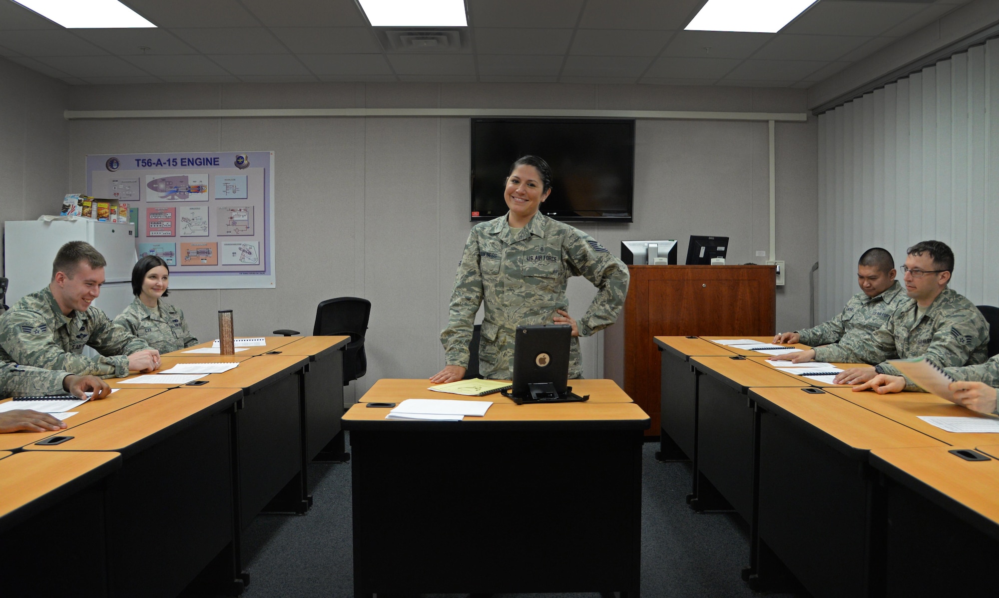 U.S. Air Force Tech. Sgt. Bernadette Van Ness, 27th Special Operations Force Support Squadron Airman Leadership School instructor, stands before a portion of the current ALS class April 29, 2015 at Cannon Air Force Base, N.M.  Van Ness takes pride in the work she does as an instructor and enjoys grooming future enlisted leaders. (U.S. Air Force photo/Staff Sgt. Alex Mercer) 