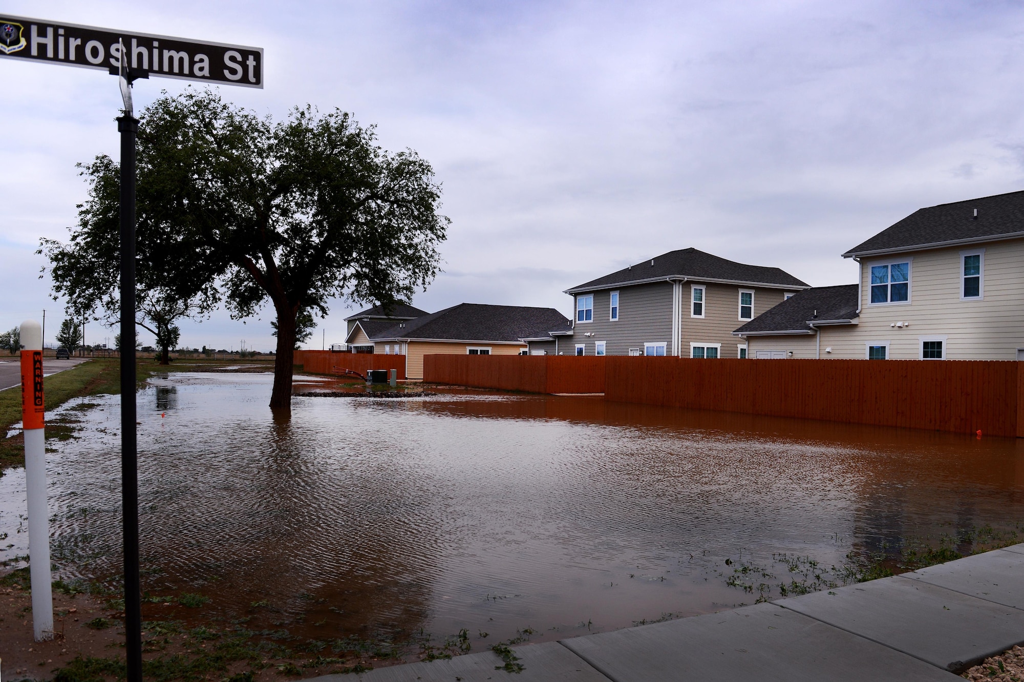 Flood water pools along homes after a severe weather storm May 5, 2015 at Cannon Air Force Base, N.M. Air Commandos and their families weathered the brunt of a colossal storm that flooded homes and other base facilities. (U.S. Air Force photo/Staff Sgt. Matthew Plew) 