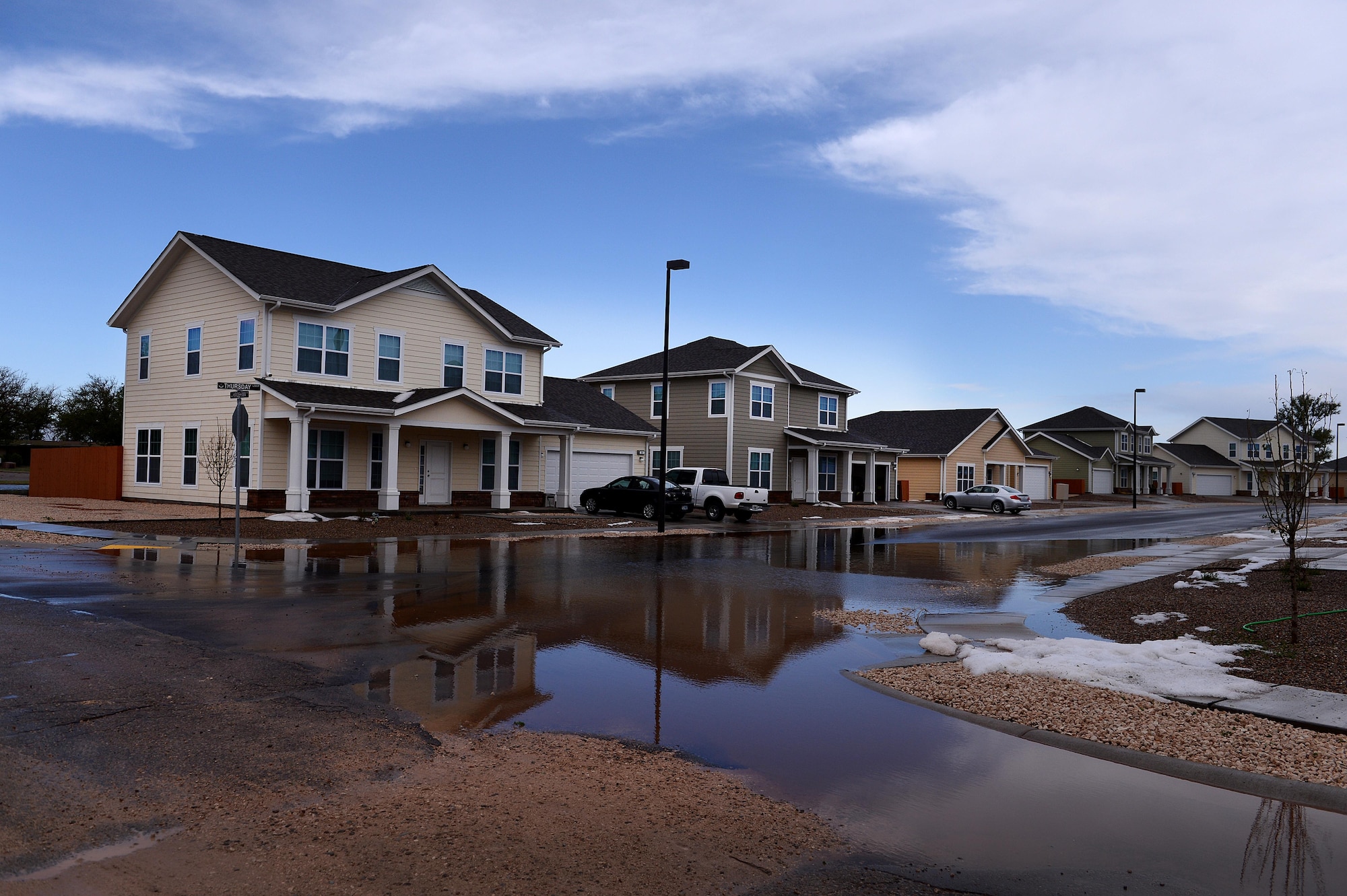 Flood water pools along homes after a severe weather storm May 5, 2015 at Cannon Air Force Base, N.M. Air Commandos and their families weathered the brunt of a colossal storm that flooded homes and other base facilities. (U.S. Air Force photo/Staff Sgt. Matthew Plew) 