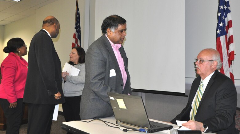 Gregory Cuyjet, deputy for small business, runs the New York District’s Small Business Office, chats with an attendee from the small business conference recently held in the tri-state area. 