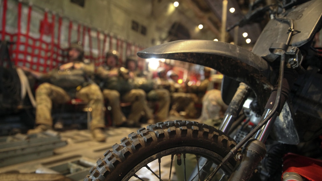 A 50 cc mini bike is secured aboard a KC-130J Super Hercules from Marine Aerial Refueler Transport Squadron 252, during a flight prior to a static line jump infiltration at Hurlburt Field, Fla., during Emerald Warrior 2015, April 28, 2015.  The mini bikes are used to patrol down the air strip before the plane lands to ensure there is no debris or hostile forces near the landing zone.  Emerald Warrior is a joint exercise led by Air Force Special Operations Command that provides pre-deployment training for U.S. and partner nation special operations forces and interagency elements.  (U.S. Marine Corps photo by Cpl. Alexander Mitchell/released)