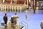 Soldiers of U.S. Army Alaska and the Indian Army stand in formation during the Yudh Abhyas 2010 opening ceremony of the annual joint and bilateral training exercise at Buckner Physical Fitness Center, Joint Base Elmendorf-Richardson, Alaska Oct. 31, 2010. Yudh Abhyas is an annual training exercise designed to strengthen ties between the armies by expanding operational and cultural knowledge with a training focus on peacekeeping operations.