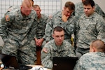Soldiers of the Virginia National Guard Data Processing Unit's Network Warfare Branch monitor network traffic during the unit's Cyber Forward exercise conducted in Fairfax, Va., Oct. 16, 2010.