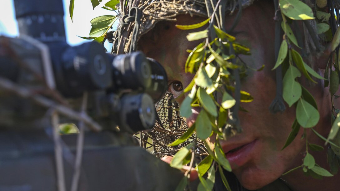 A Marine scout sniper candidate with Scout Sniper Platoon, Weapons Company, 2nd Battalion, 2nd Marine Regiment looks through the scope of his weapon during a stalking exercise in the vicinity of SR-10 aboard Marine Corps Base Camp Lejeune, North Carolina, April 22, 2015. The exercise taught Marines the importance of concealment during movement to a target and while firing from a position at a target. The stalking exercise was one of many conducted by Marines attending the Scout Sniper Basic Preparation Course over the course of two weeks during the month of April. 