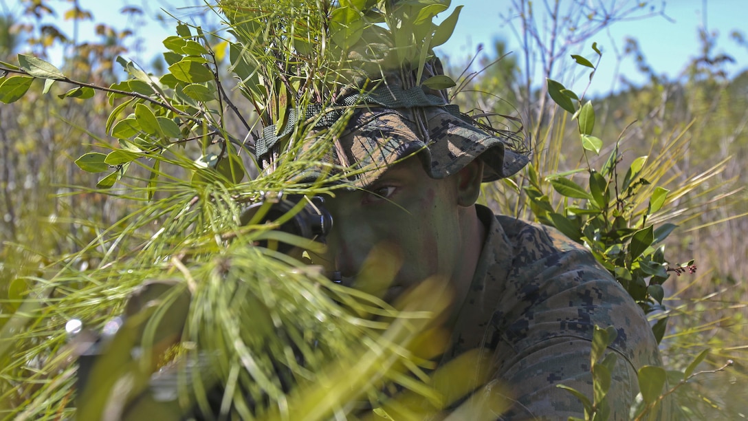 A Marine scout sniper candidate with Scout Sniper Platoon, Weapons Company, 2nd Battalion, 2nd Marine Regiment looks through the scope of his rifle during a stalking exercise in the vicinity of SR-10  aboard Marine Corps Base Camp Lejeune, North Carolina, April 22, 2015. The stalking exercise taught Marines the importance of going undetected during movement and while firing at a target. The stalking exercise was one of many conducted by Marines attending the Scout Sniper Basic Preparation Course over the course of two weeks during the month of April.