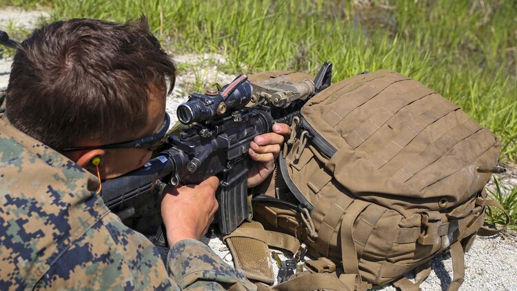 Lance Cpl. Richard Marsh, a scout sniper candidate with Scout Sniper Platoon, Weapons Company, 2nd Battalion, 2nd Marine Regiment fires at a target from an unknown distance during a live-fire exercise at SR-10 aboard Marine Corps Base Camp Lejeune, North Carolina, April 22, 2015. The unknown distance live-fire exercise was the last event during a two week Basic Scout Sniper Course Preparation Course.