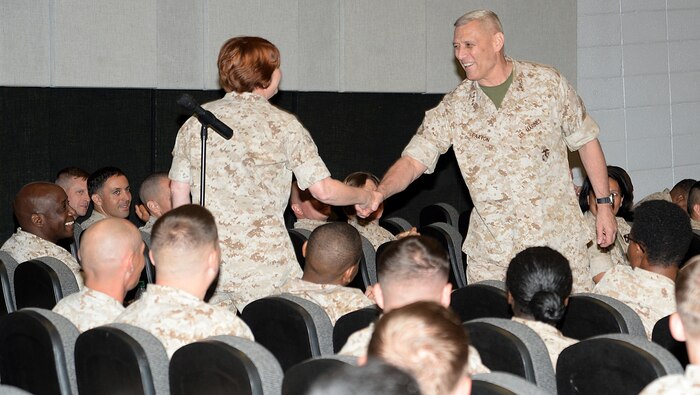 Assistant Commandant of the Marine Corps Gen. John M. Paxton Jr. shakes hands with Maj. Billie Rankin, Marine Corps Logistics Command, during a town hall meeting at Marine Corps Logistics Base Albany’s Base Theater, May 5. Paxton conducted the meeting to update his Marines here on the state of the Marine Corps.