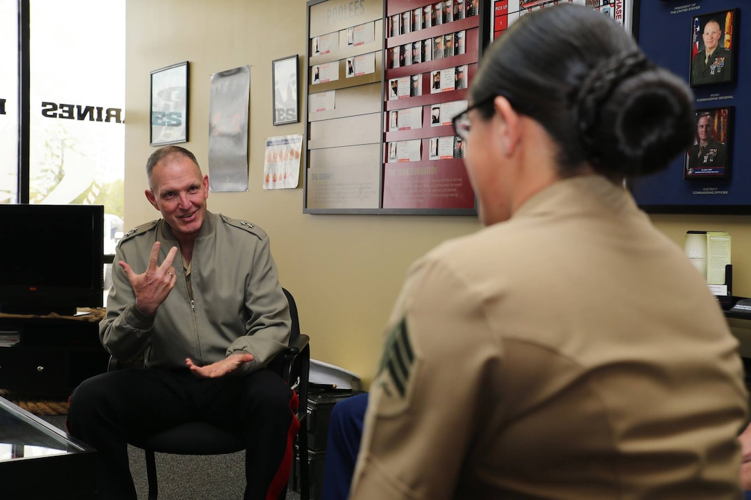 Major General Mark A. Brilakis, Commanding General Marine Corps Recruiting Command, spoke with Sergeant Nubia Z. Leon-Lozano at  Permanent Contact Station Anderson during a visit to Recruiting Station Indianapolis April 27, 2015. Photo by LCpl Zachery B. Martin
