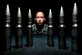 Tech. Sgt. Robert Kurz, the 20th Equipment Maintenance Squadron assistant first sergeant, stands behind training 20mm rounds at Shaw Air Force Base, S.C., April 28, 2015. Kurz realigned the inspection and tracking process for the F-16 Fighting Falcon’s Gatling gun system that affected the Air Force’s entire F-16 fleet. (U.S. Air Force photo/Senior Airman Jensen Stidham) 