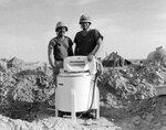 Sgt. Haskell Mills, left, and Sgt. Ricky Newsom, right, pose with a ringer washer belonging to the Tennessee Army National Guard's 212th Engineer Company during Operation Desert Shield. It is the last known photo of the washer. Shortly after this photo was taken, the company left the camp for a mission. As the Tennessee Army Guardsmen returned, they observed the machine disappearing into the clouds slung under the belly of a helicopter. Luckily, the two sergeants had removed their laundry before the incident. A majority of the 65,000 Army Guardsmen deployed in support of the operation were combat service support troops.