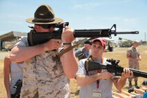 Teachers and influencers from Indiana joined Marines from Recruiting Station Indianapolis in the 2015 Educator's Workshop. During the workshop a Primary Marksmanship Instructor taught educator's how to shoot the M16A4 on Edson Range, Marine Corps Base Camp Pendleton, California. Photo by Sgt. Tyler S. Mitchell