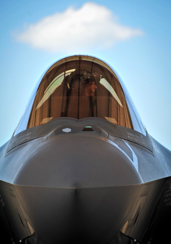 Lt. Col. Christine Mau, 33rd Operations Group deputy commander, reacts to the sight of her friends greeting her after completing her first training flight at Eglin Air Force Base, Florida, May 5, 2015. Mau, who previously flew F-15E Strike Eagles, made history as the first female F-35 pilot in the program. (U.S. Air Force photo/Staff Sgt. Marleah Robertson)