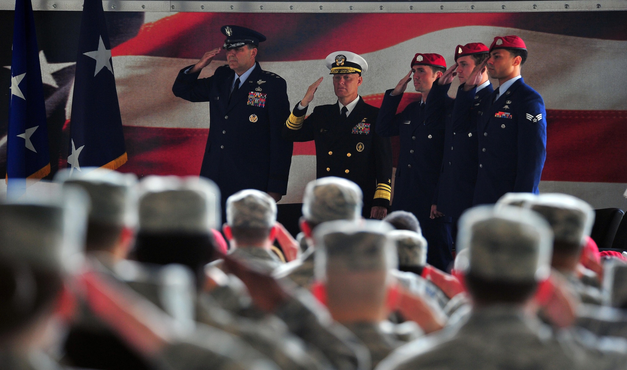 U.S. Air Force Lt Gen Bradley A. Heithold, commander of Air Force Special Operations Command, and U.S. Navy Vice Admiral Sean A. Pybus, deputy commander of Special Operations Command, stand beside three U.S. Air Force Special Tactics combat controllers, who received an Air Force Cross and two Silver Stars. They are credited with saving the lives of more than 80 U.S. Army Special Forces and Afghan Commando teammates by providing flawless air-to-ground integration in the special operations battlefield. (U.S. Air Force photo by Airman First Class Ryan Conroy/Released)