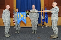 Chief Master Sgt. Eric Culver, Air Force Installation and Mission Support Center Detachment 7 senior enlisted leader (from left to right); Maj. Gen. Theresa Carter, AFIMSC commander; Col. Brian Murphy, incoming AFIMSC Detachment 7 commander; and Chief Master Sgt. Jose LugoSantiago, AFIMSC command chief master sergeant, participate in the official unfurling ceremony of the AFIMSC Detachment 7 flag during the detachment activation May 6 at Joint Base San Antonio-Randolph, Texas.  Detachment 7 combines and oversees functions in the security forces, civil engineer, base communications, logistics readiness, installation ministry programs, services, operational contracting and financial management fields. The mission of the detachment is to synchronize and execute installation and mission support for commanders from Air Education and Training Command.  AFIMSC serves as a single intermediate-level headquarters for the delivery of installation support capabilities throughout the Air Force and reports to Air Force Materiel Command. (U.S. Air Force photo by Melissa Peterson)