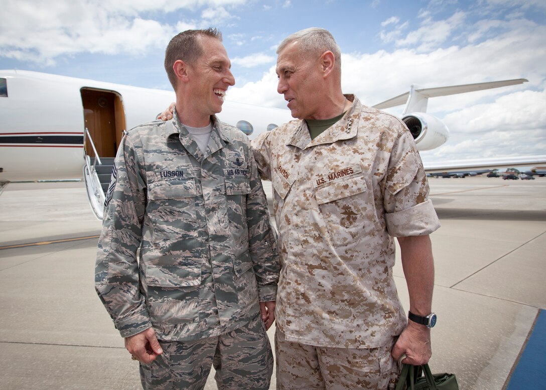 The Assistant Commandant of the U.S. Marine Corps, Gen. John M. Paxton, Jr., right, speaks with Command Chief Master Sgt. Matthew S. Lusson upon arriving at Marine Corps Forces Central Command, MacDill Air Force Base, Tampa, Fla., May 5, 2015. (U.S. Marine Corps photo by Cpl. Tia Dufour/Released)
