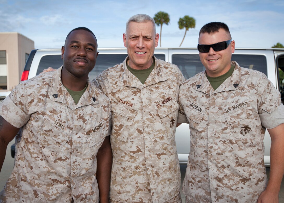 The Assistant Commandant of the U.S. Marine Corps, Gen. John M. Paxton, Jr., center, poses for a photo while visiting Marine Corps Forces Central Command at MacDill Air Force Base, Tampa, Fla., May 5, 2015. (U.S. Marine Corps photo by Cpl. Tia Dufour/Released)