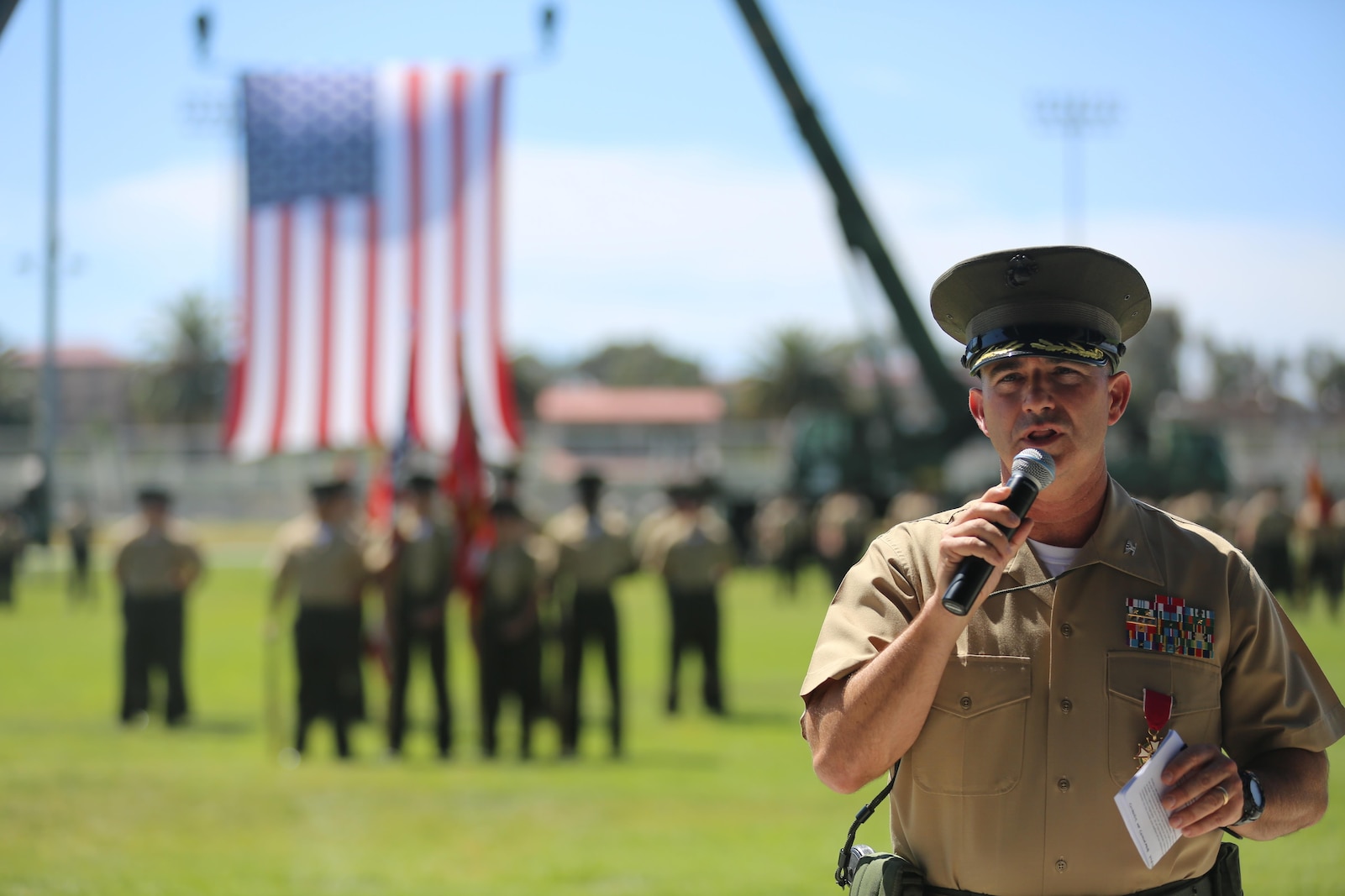 U.S. Marine Corps Col. Eric B. Kraft, off going commanding officer, Headquarters Regiment, 1st Marine Logistics Group, 1 Marine Expeditionary Force, addresses a crowd during the Change of Command Ceremony for Headquarters Regiment aboard Camp Pendleton Calif., May 1, 2015. The Change of Command Ceremony for Headquarters Regiment showcased the passing of command from Col. Eric B. Kraft to Col. Phillip N. Frietze. (U.S. Marine Corps Photo by Cpl. Rodion Zabolotniy, combat camera/ released)