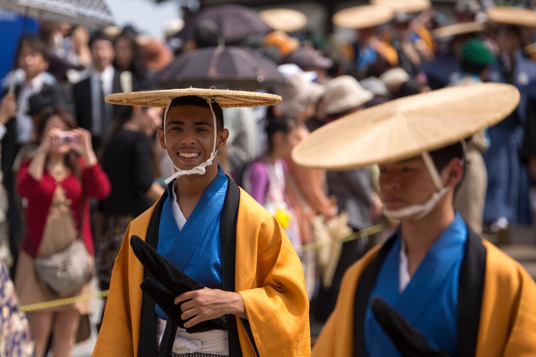 Lance Cpl. Carlos Cruz Jr., a combat correspondent with the Public Affairs Office aboard Marine Corps Air Station Iwakuni, Japan, walks in the Daimyo Procession during the 38th Annual Kintai-kyo Bridge Festival, in Iwakuni City, April 29, 2015. The procession is an annual parade that reenacts the return of a daimyo, one of the most powerful feudal rulers who is subordinate only to the shogun and his entourage from the capital of Japan.