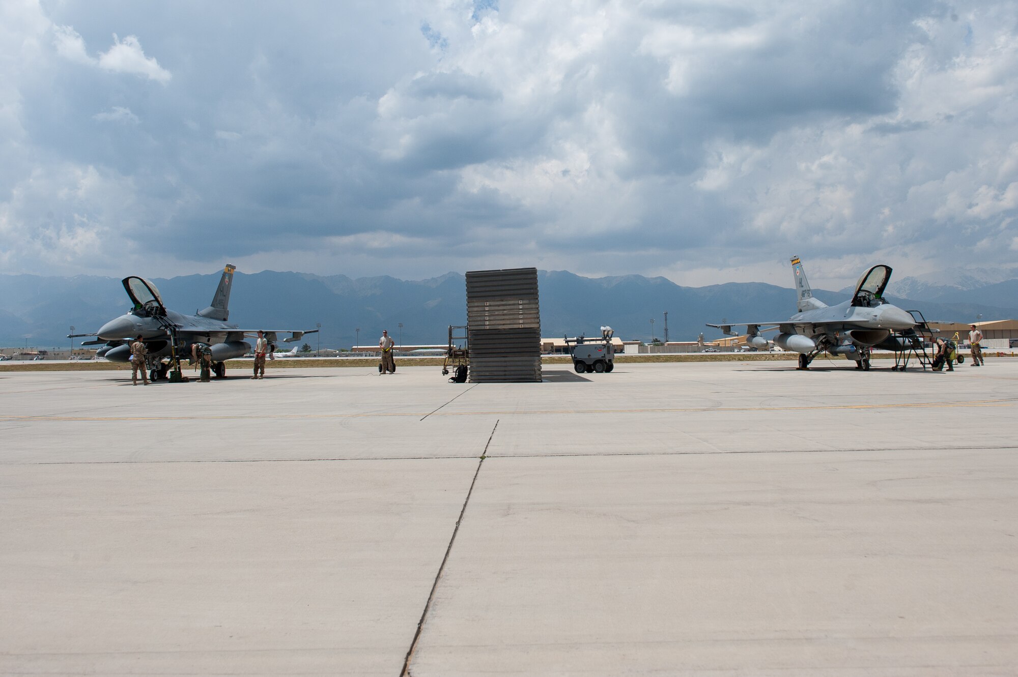 Two F-16 Fighting Falcon aircraft, assigned to the 4th Fighter Squadron from Hill Air Force Base, Utah, prepare to leave Bagram Airfield, Afghanistan, April 30, 2015. The “Fuujins” of the 4th FS provided decisive airpower to ground commanders in Afghanistan throughout their six month deployment, flying more than 8,000 hours in the F-16 in support of operations Enduring Freedom and Freedom’s Sentinel.  (U.S. Air Force photo by Tech. Sgt. Joseph Swafford/Released)