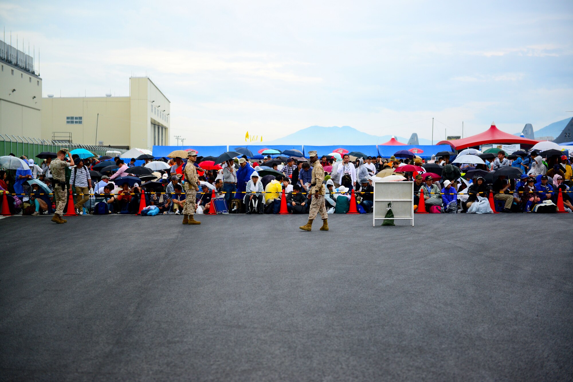 A crowd gathers at the Japan Maritime Self-Defense Force/Marine Corps Air Station Iwakuni Friendship Day 2015 Air Show at MCAS Iwakuni, Japan, May 3, 2015. This year the event expanded to combine both the JMSDF’s Fleet Air Wing 31 Annual Open House and the traditional MCAS Iwakuni Friendship Day, resulting in the first-ever joint Friendship Day air show. (U.S. Air Force photo by Tech Sgt. Melissa K. Mekpongsatorn/Released)