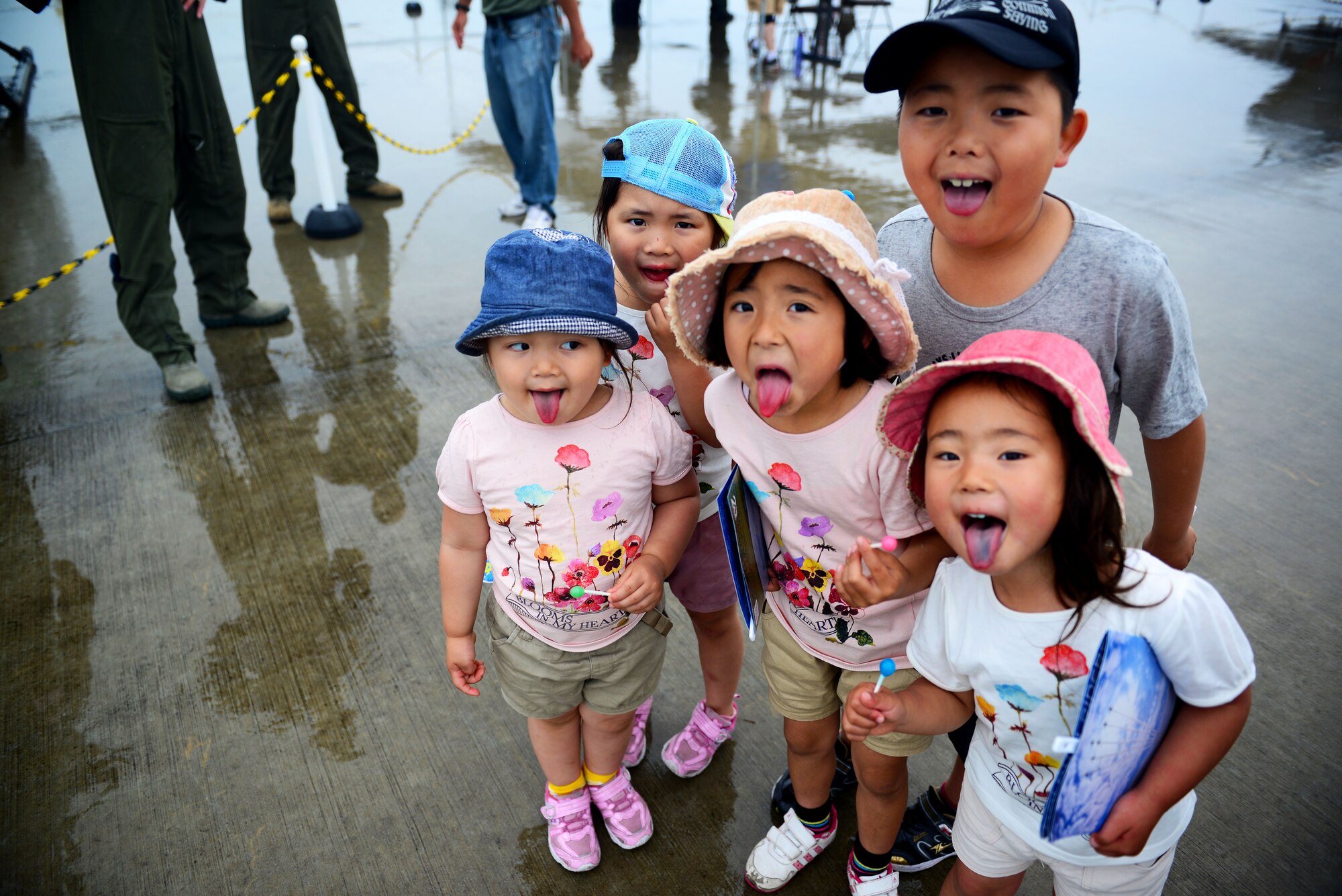 Local children pose for a photo during Friendship Day 2015 at Marine Corps Air Station Iwakuni, Japan, May 3, 2015, MCAS and Japan Maritime Self-Defense Force hosted it's first-ever joint Friendship Day 2015 Air Show. The event allowed visitors from all over the chance to see several aircraft demonstrations and to interact with Japanese and American service members. (U.S. Air Force photo by Tech Sgt. Melissa K. Mekpongsatorn/Released)