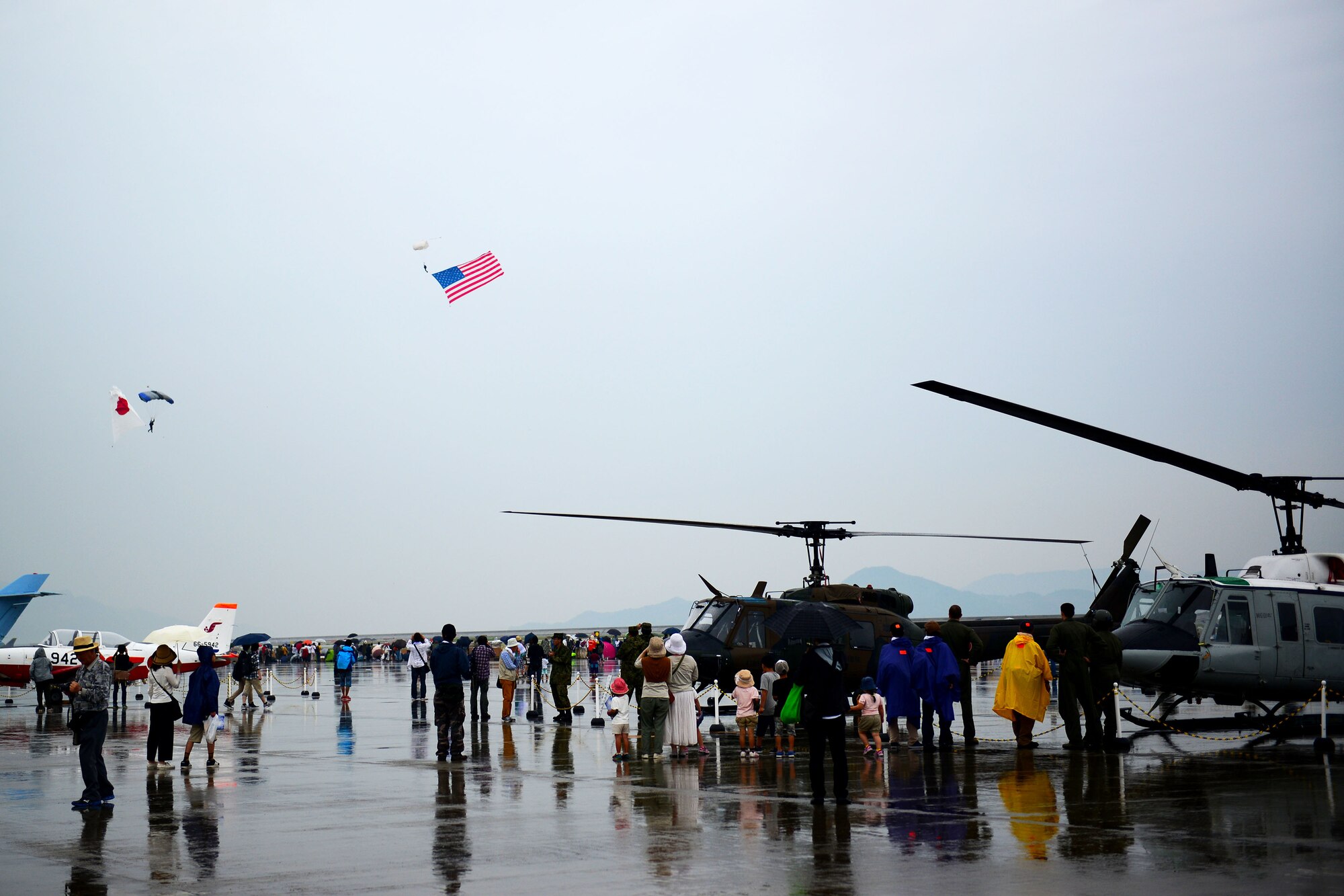 Marine Corps Air Station Iwakuni, Japan, and Japan Maritime Self-Defense Force hosted it's first-ever joint Friendship Day 2015 Air Show at MCAS Iwakuni, Japan, May 3, 2015. Highlighting the joint aspect of the air show, Air Force pilots with the 459 Airlift Squadron from Yokota Air Base, Japan, brought a UH1N and a C-12 to the airshow to showcase their airlift capabilities to the visitors. (U.S. Air Force photo by Tech Sgt. Melissa K. Mekpongsatorn/Released)