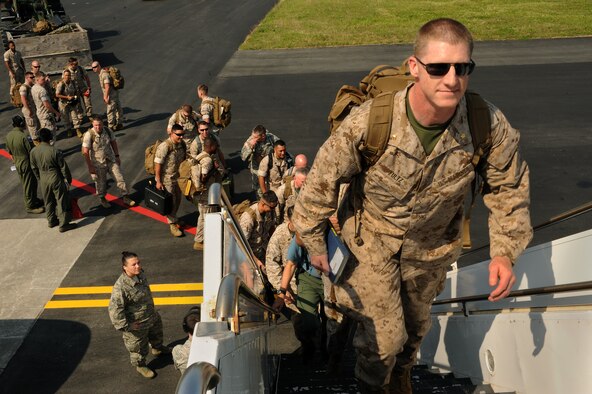 U.S. Marine Corps Maj. Brad Fultz, 3rd Marine Expeditionary Brigade foreign area officer, boards a U.S. Air Force KC-135 Stratotanker with members of the 3rd Marine Expeditionary Force on Kadena Air Base, Japan, May 6, 2015. Two KC-135s from Kadena’s 909th Air Refueling Squadron transported approximately 50 Marines and a handful of Army personnel to support of the Department of Defense’s humanitarian efforts for Nepal following the 7.8 magnitude earthquake there April 25. (U.S. Air Force photo by Airman 1st Class Zade C. Vadnais)