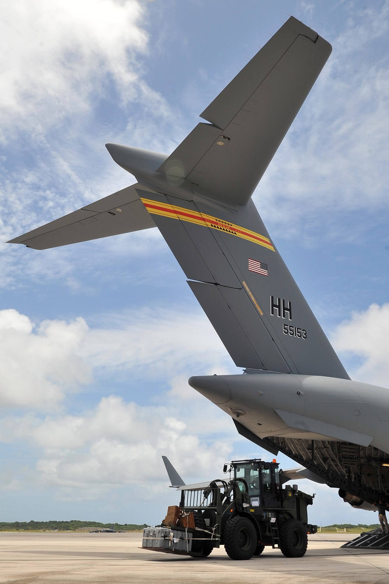 A 734th Air Mobility Squadron Airman loads a forklift inside a C-17 Globemaster III May 4, 2015, at Andersen Air Force Base, Guam, in preparation for deployment to Nepal. The 36th Contingency Response Group is a rapid-deployment unit designed to establish and maintain airfield operations in a forward operating location and is prepared to assist with the Nepal earthquake recovery efforts. (U.S. Air Force photo by Staff Sgt. Melissa B. White/Released)