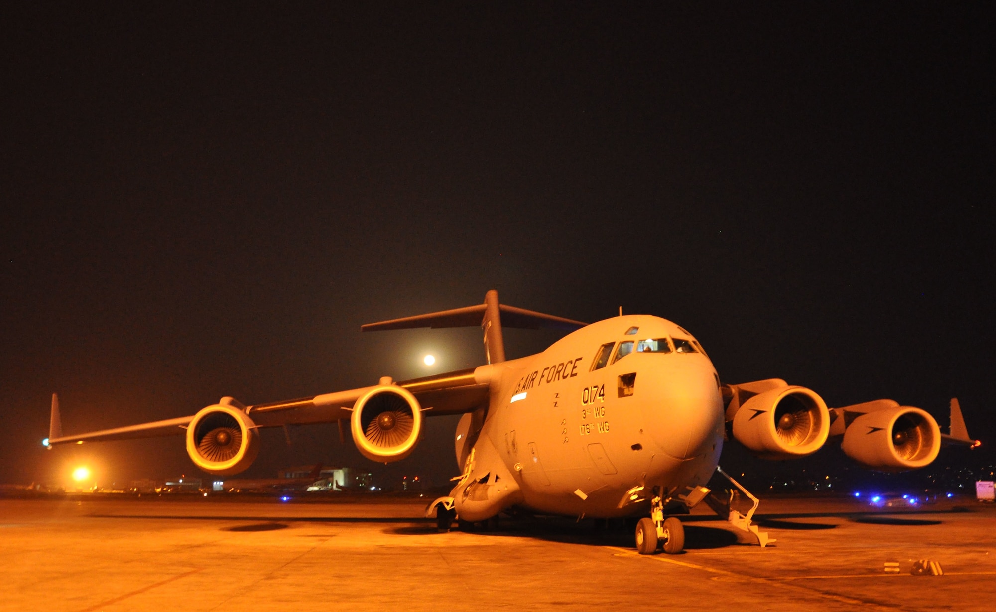 A U.S. Air Force C-17 Globemaster III from Joint Base Pearl Harbor-Hickam, Hawaii, lands in Tribhuvan International Airport, Nepal, May 4, 2015. The C-17s carried members of the 36th Contingency Response Group who joined U.S. Department of State and U.S. Agency for International Development led humanitarian and disaster relief operations in support of the government and armed forces of Nepal. (U.S. Air Force photo by Maj. Ashley Conner/Released)