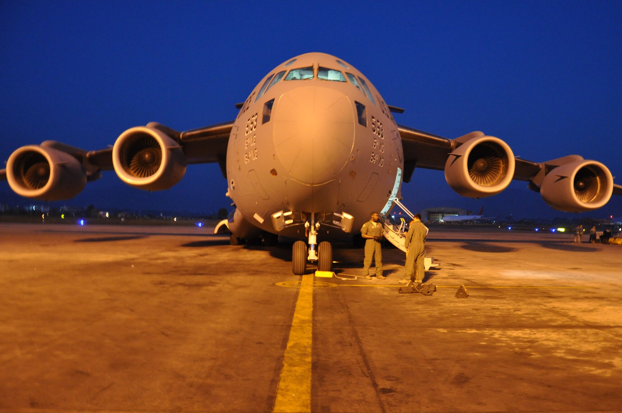 A U.S. Air Force C-17 Globemaster III from Joint Base Pearl Harbor-Hickam, Hawaii, lands in Tribhuvan International Airport, Nepal, May 4, 2015. The C-17s carried members of the 36th Contingency Response Group who joined U.S. Department of State and U.S. Agency for International Development led humanitarian and disaster relief operations in support of the government and armed forces of Nepal. (U.S. Air Force photo by Maj. Ashley Conner/Released)