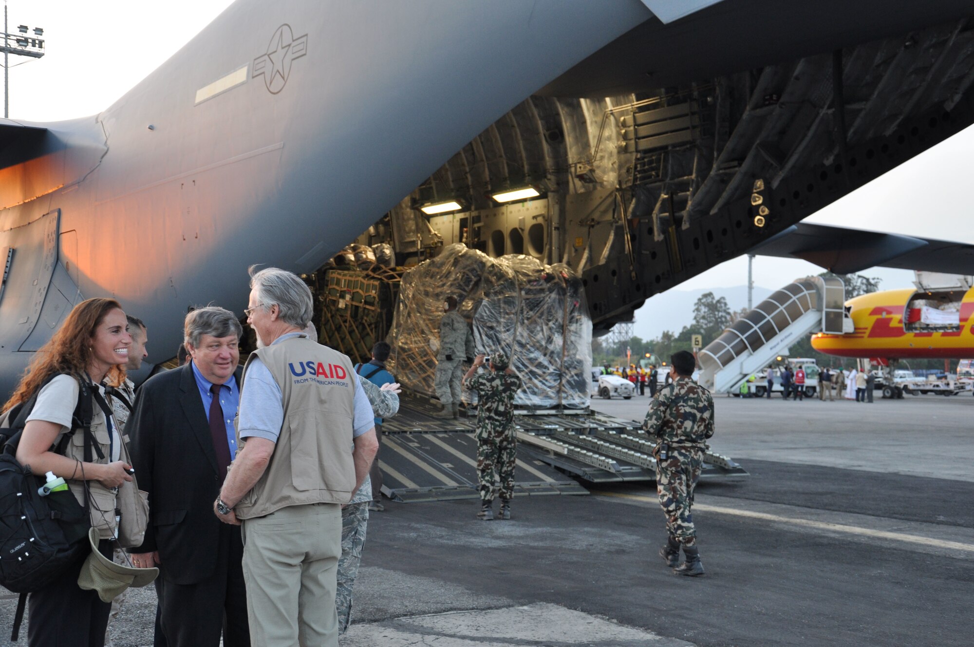 A team of Nepalese service members help unload equipment on a U.S. Air Force C-17 Globemaster III, at Tribhuvan International Airport, Nepal, May 4, 2015. The C-17 transported members of the 36th Contingency Response Group who joined U.S. Department of State and U.S. Agency for International Development led humanitarian and disaster relief operations in support of the government and armed forces of Nepal. (U.S. Air Force photo by Maj. Ashley Conner/Released)