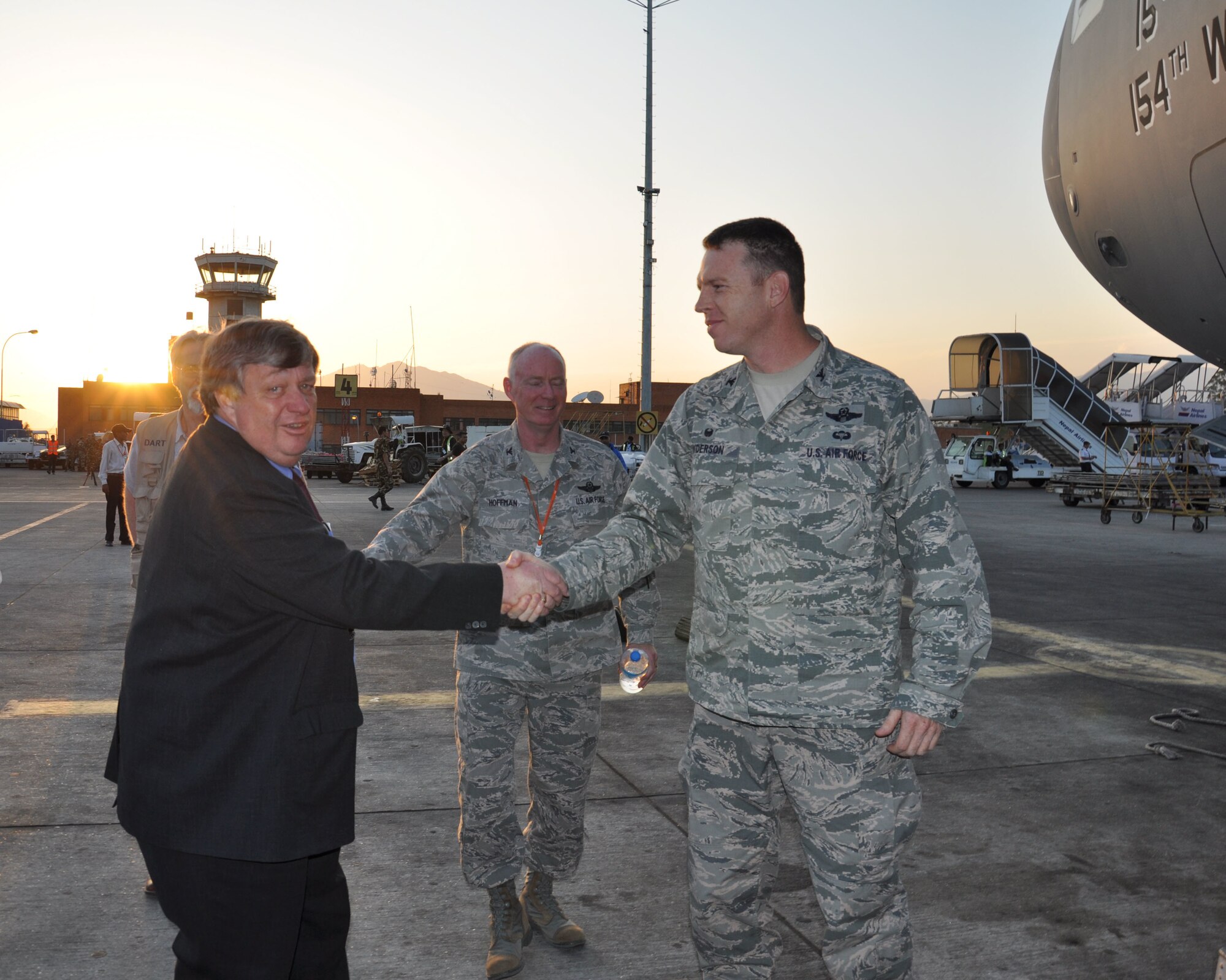 U.S. Ambassador to Nepal Peter W. Bodde greets Col. Lee Anderson, 36th Contingency Response Group commander, after Anderson and his 40-person team landed in Tribhuvan International Airport, Nepal, May 4, 2015. The CRG joined U.S. Department of State and U.S. Agency for International Development led humanitarian and disaster relief operations in support of the government and armed forces of Nepal. (U.S. Air Force photo by Maj. Ashley Conner/Released)