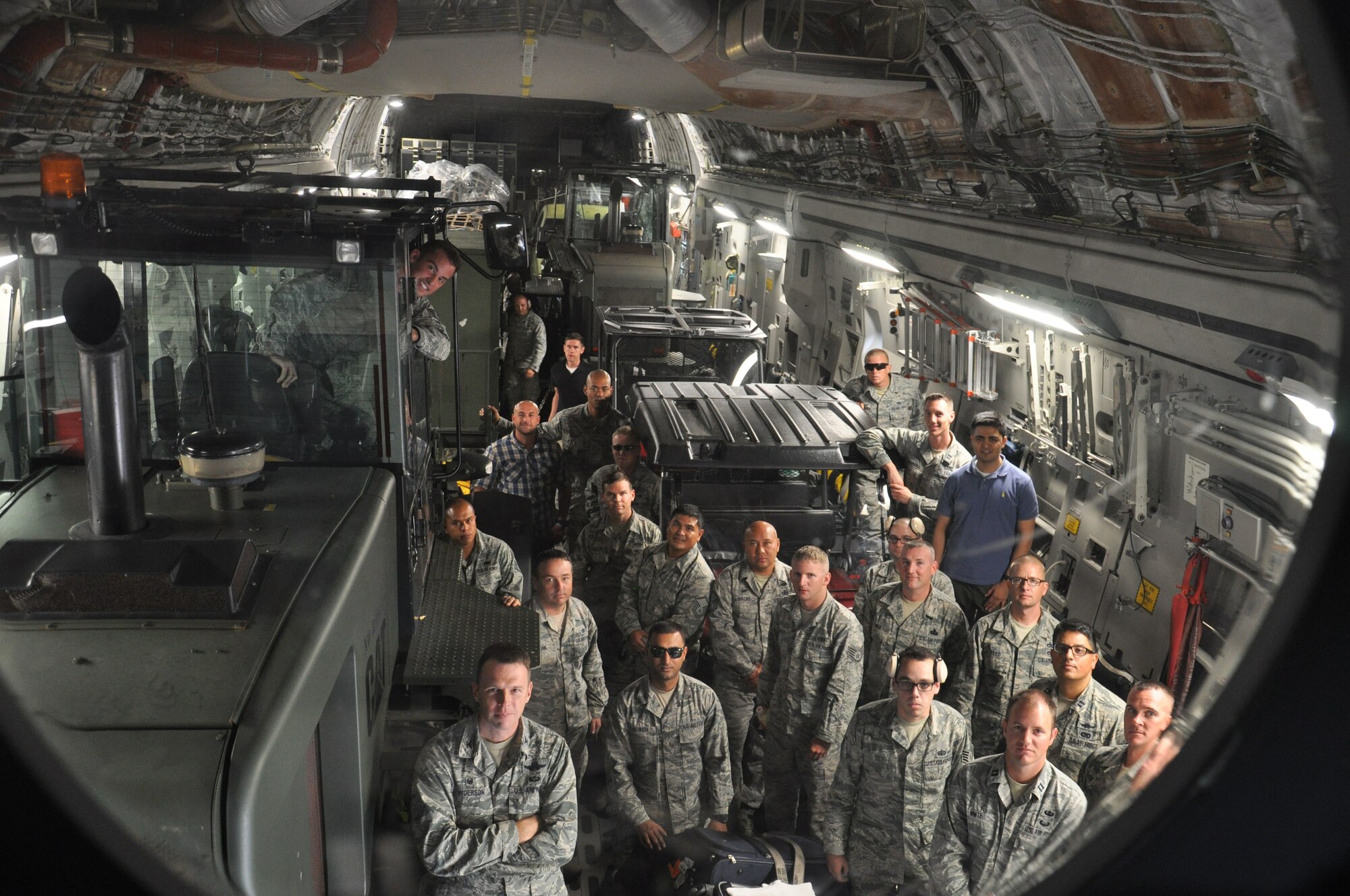 Members of the 36th Contingency Response group board a C-17 Globemaster III destined for Kathmandu, Nepal, at Andersen Air Force Base, Guam, May 4, 2015. The CRG will join U.S. Department of State and U.S. Agency for International Development led humanitarian and disaster relief operations in support of the government and armed forces of Nepal.  (U.S. Air Force photo by Maj. Ashley Conner/Released)