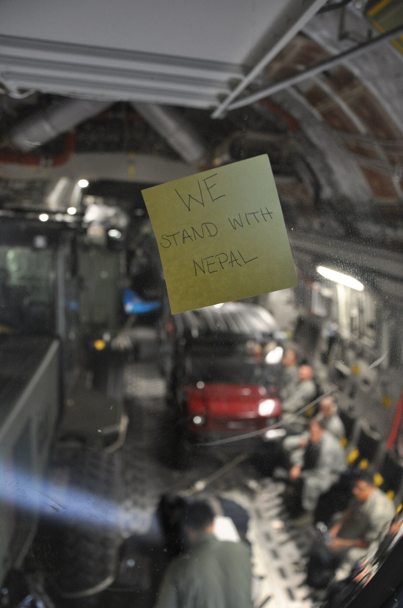 A U.S. Air Force C-17 Globemaster III transports members of the 36th Contingency Response Group and their equipment, at Andersen Air Force Base, Guam, May 4, 2015. The CRG will join U.S. Department of State and U.S. Agency for International Development led humanitarian and disaster relief operations in support of the government and armed forces of Nepal. (U.S. Air Force photo by Maj. Ashley Conner/Released)
