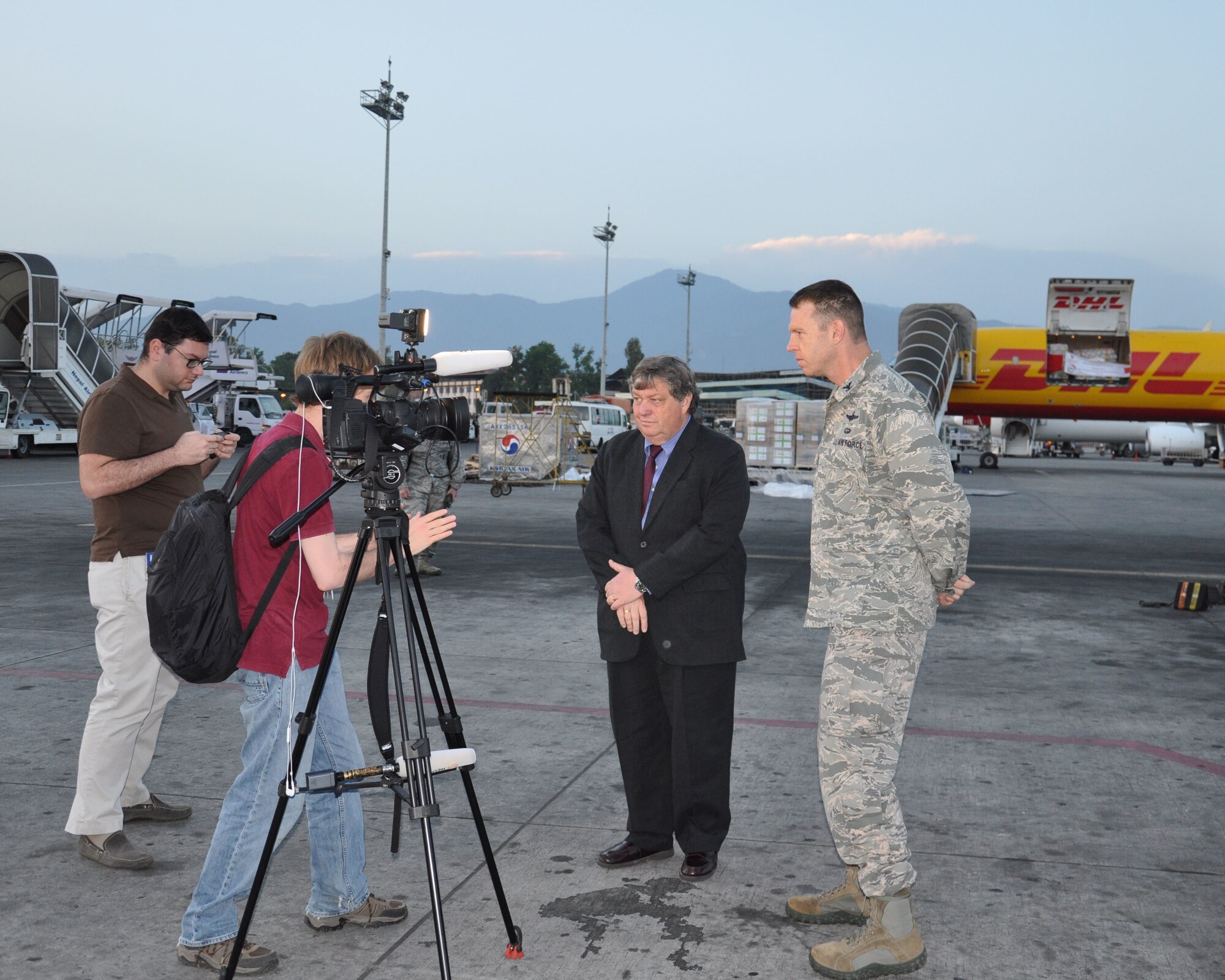 U.S. Ambassador to Nepal Peter Bodde and Col. Lee Anderson, 36th Contingency Response Group commander, conduct an interview with Reuters about the U.S. military support to Nepal, at Tribhuvan International Airport, Nepal, May 4, 2015. Anderson and his 40-man CRG team joined U.S. Department of State and U.S. Agency for International Development led humanitarian and disaster relief operations in support of the government and armed forces of Nepal. (U.S. Air Force photo by Maj. Ashley Conner/Released)