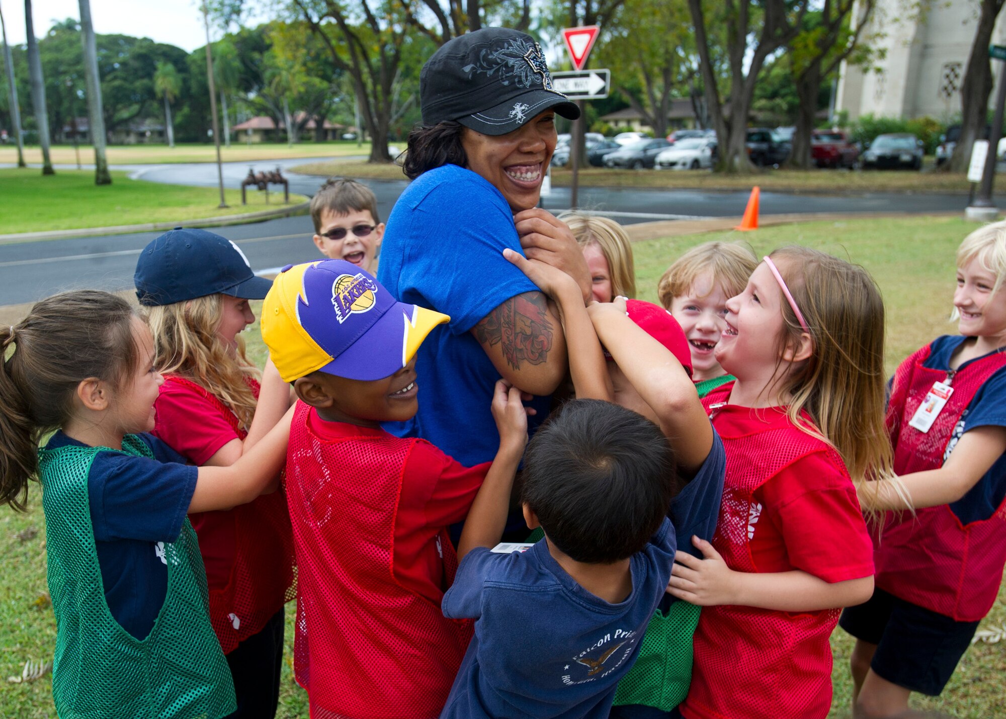 First grade students of Hickam Elementary School play a fitness game inspired by Dr. Seuss’ “How the Grinch Stole Christmas,” as part of Teacher Appreciation Week on Joint Base Pearl Harbor-Hickam, Hawaii, May 5-8. To celebrate the teachers and offer them well-deserved time off, Airmen volunteered their time to supervise the kindergarten through sixth grade students as their teachers enjoyed the Hickam Historical Tour, learning about the history of the base and the Hickam community. (U.S Air Force photo by 2nd Lt. Kaitlin Daddona/Released)

