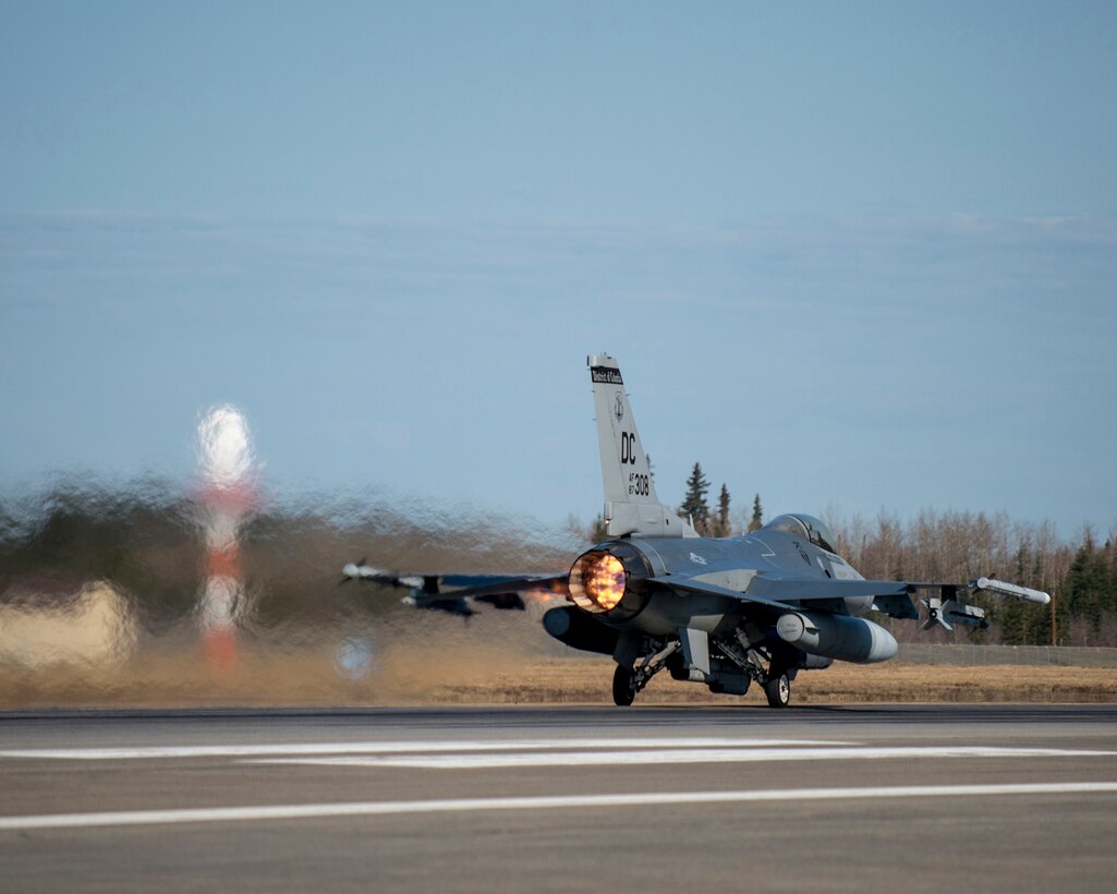 An F-16 Fighting Falcon from the 113th Wing, District of Columbia Air National Guard, launches down the runway May 6, 2015, during RED FLAG-Alaska 15-2 at Eielson Air Force Base, Alaska. The two-week long exercise takes place within the Joint Pacific Alaska Range Complex, a 67,000 square-mile training range. (U.S. Air Force photo by Staff Sgt. Shawn Nickel/Released) 
