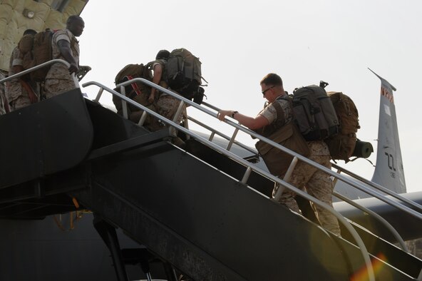 U.S. Marines from the 3rd Marine Expeditionary Force board a U.S. Air Force KC-135 Stratotanker headed for Nepal on Kadena Air Base, Japan, May 6, 2015. Two KC-135s from Kadena’s 909th Air Refueling Squadron transported more than 60 Marines, soldiers and Airmen to Nepal to provide humanitarian assistance following the devastating earthquake that took place there April 25. (U.S. Air Force photo by Airman 1st Class Zade C. Vadnais)