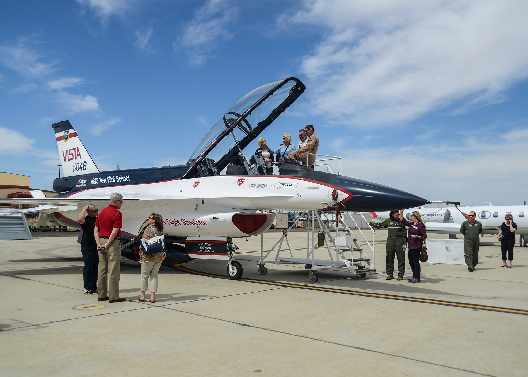 Honorary Commanders and their guests had the chance to see United States Air Force Test Pilot School aircraft up close, including the NF-16D VISTA in-flight simulator. VISTA is an acronym that stands for Variable stability In-flight Simulator Test Aircraft. The modified F-16 can be configured to fly like almost any aircraft type. (U.S. Air Force photo by Rebecca Amber)