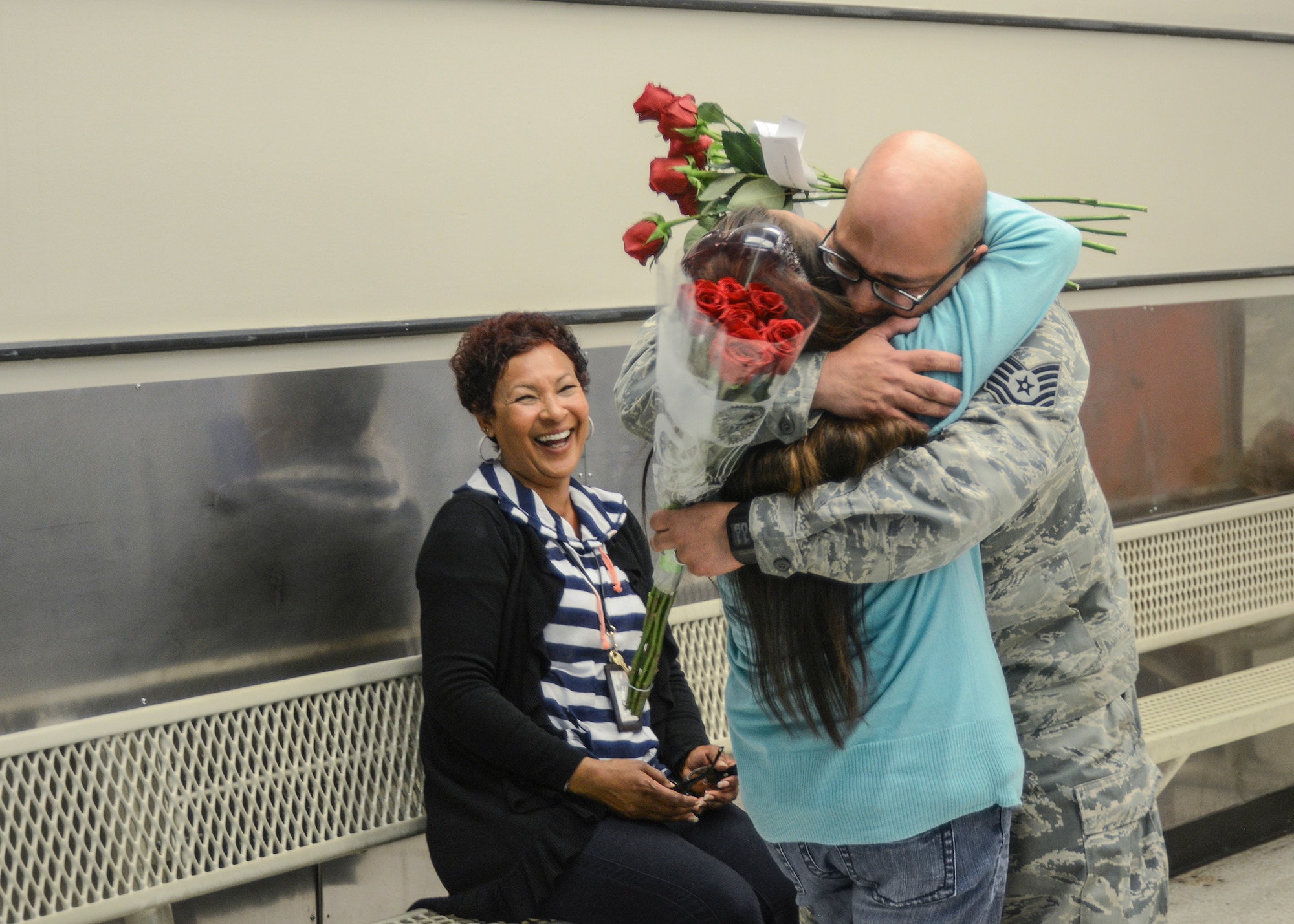 After months of separation, Tech. Sgt. Donald Martinez Jr., 31st Tests and Evaluation Squadron, reunites with his wife Araceli at the Commissary where she works as a bagger May 5. (U.S. Air Force photo by Rebecca Amber) 