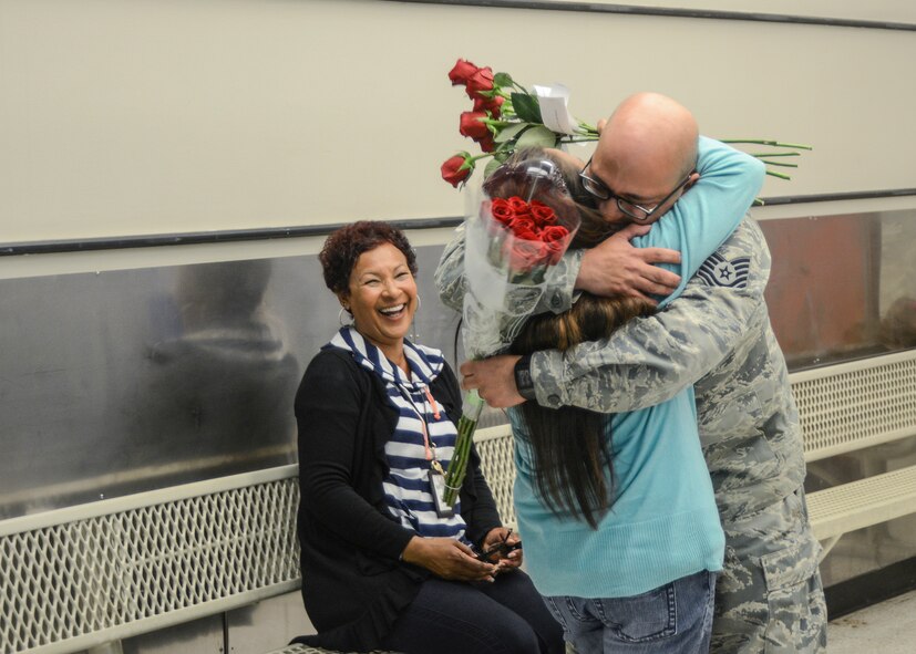 After months of separation, Tech. Sgt. Donald Martinez Jr., 31st Tests and Evaluation Squadron, reunites with his wife Araceli at the Commissary where she works as a bagger May 5. (U.S. Air Force photo by Rebecca Amber) 