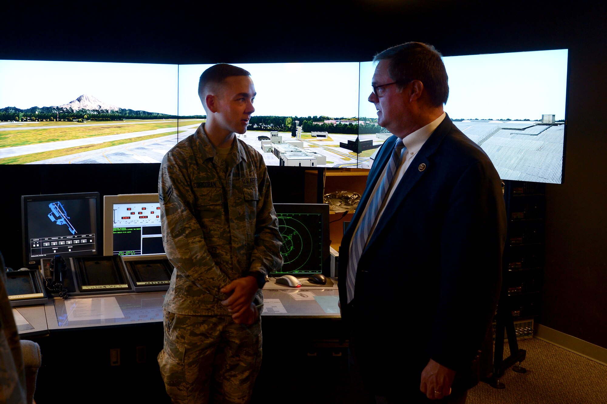 Congressman Denny Heck, WA-10, talks with Airman 1st Class Austin Corcoran, 62nd Operations Support Squadron air traffic controller, in the tower simulator May 6, 2015, at Joint Base Lewis-McChord, Wash. Heck toured the base air traffic control tower and simulator as part of his community update brief. (U.S.  Air Force photo \ Staff Sgt. Tim Chacon)