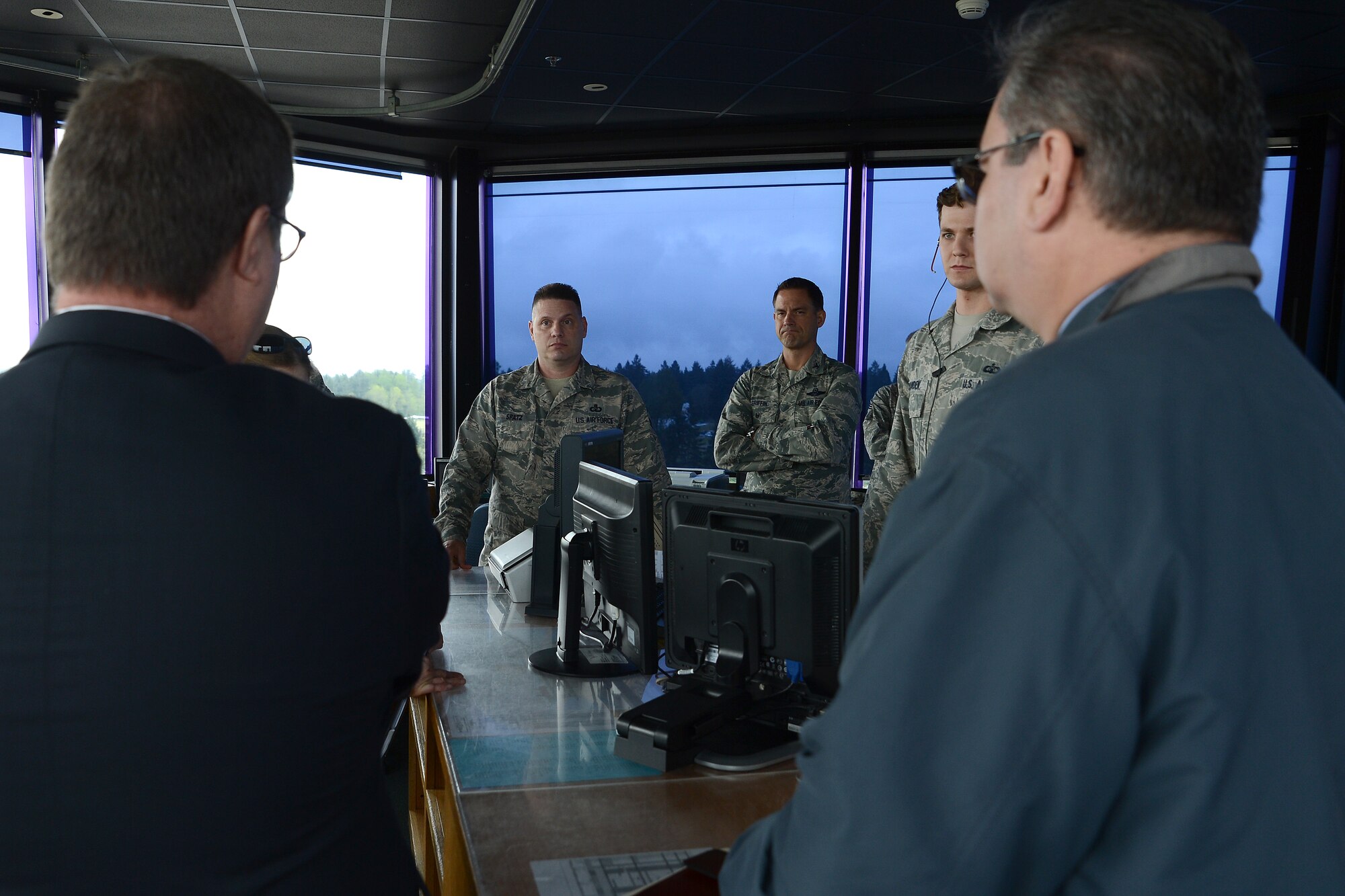 Senior Master Sgt. Carl Spatz (center, left), 62nd Operations Support Squadron chief tower controller, briefs Congressman Denny Heck, WA-10, about operations in the McChord tower May 6, 2015, at Joint Base Lewis-McChord, Wash. The McChord tower was one stop on Heck’s JBLM visit for a community update brief. (U.S.  Air Force photo \ Staff Sgt. Tim Chacon)
