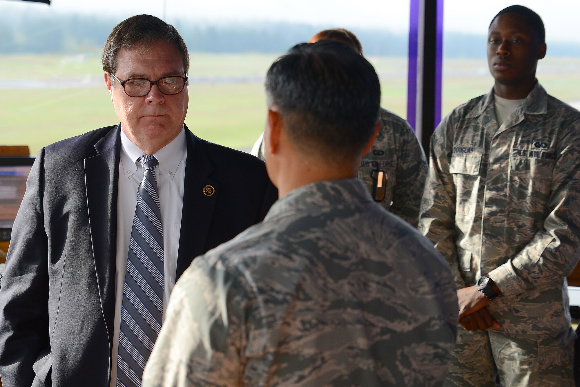 Congressman Denny Heck, WA-10, receives a community update brief from Airmen in the McChord tower May 6, 2015, at Joint Base Lewis-McChord, Wash. Heck was briefed about air field management as well as base improvement projects on McChord Field. (U.S.  Air Force photo \ Staff Sgt. Tim Chacon)