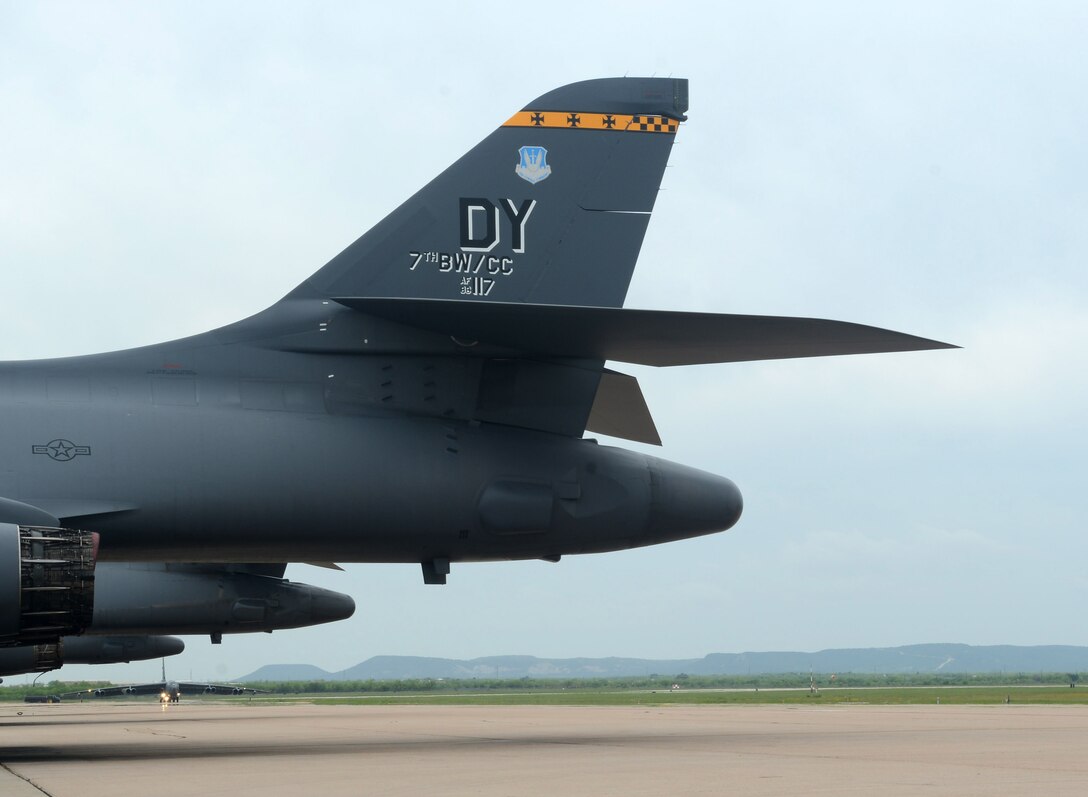 A U.S. Air Force B-52H Stratofortress from the 340th Weapons Squadron, Barksdale Air Force Base, La., taxis past a B-1B Lancer April 23, 2015, at Dyess Air Force Base, Texas. The 77th WPS and the 340th WPS recognized the need to increase bomber stand-off weapons training between different bomber airframes. This exercise marks the first step in increasing Stand-Off Weapons Integration Training, which plays a vital role in bomber integration. (U.S. Air Force photo by Airman 1st Class Alexander Guerrero/ Released)
