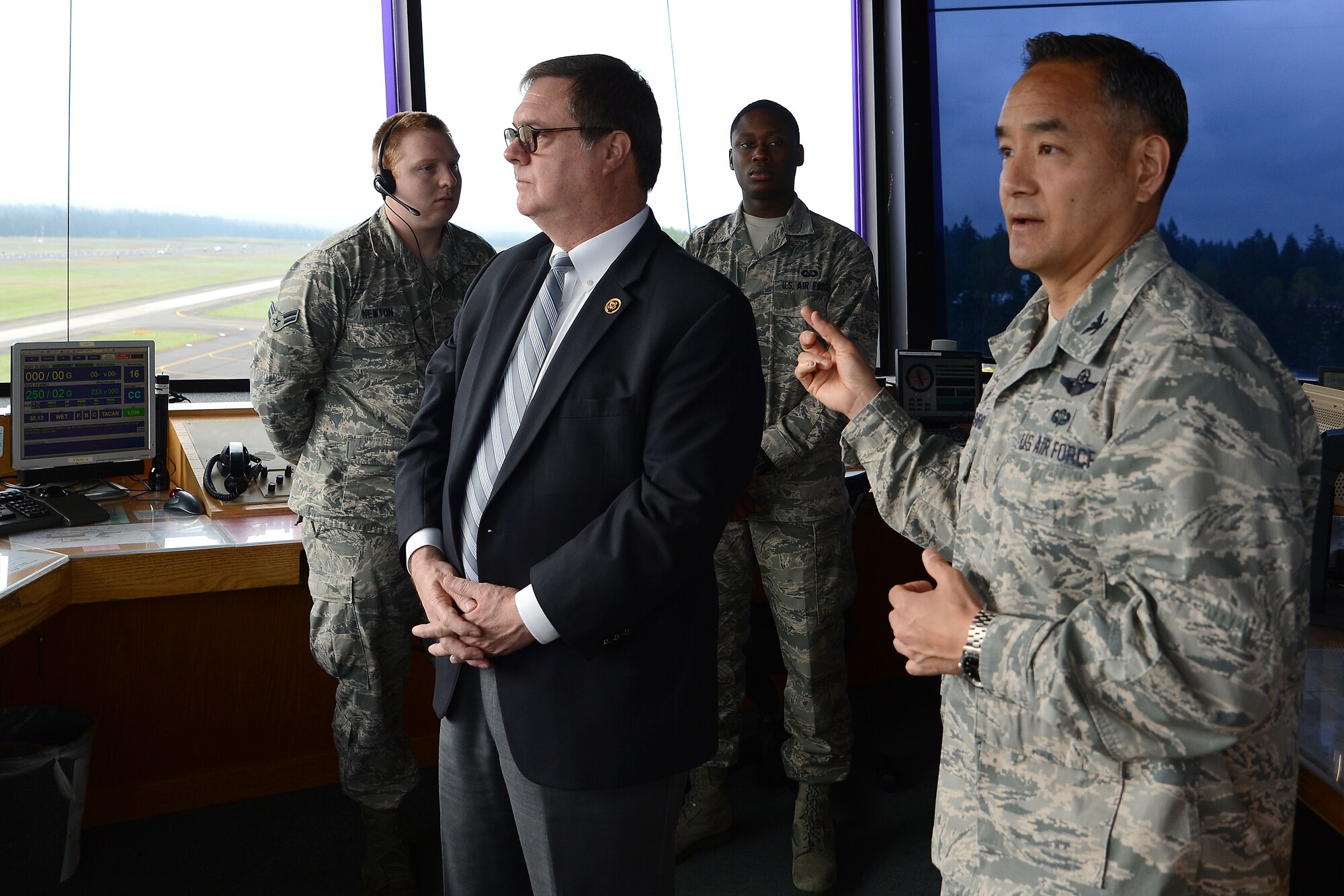 Col. David Kumashiro (right), 62nd Airlift Wing commander, talks with Congressman Denny Heck, WA-10, in the McChord tower May 6, 2015, at Joint Base Lewis-McChord, Wash. Kumashiro and Heck talked about air field management as well as base improvement projects on McChord Field. (U.S.  Air Force photo \ Staff Sgt. Tim Chacon)
