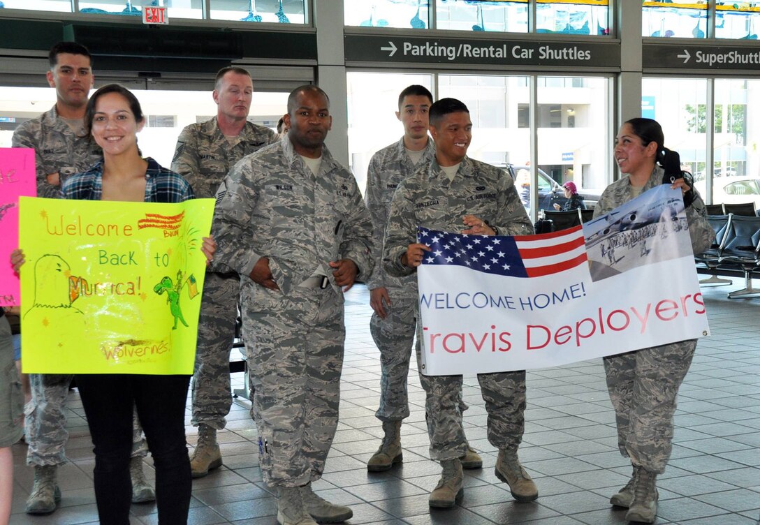 Members of Team Travis, military families and the Patriot Guard Riders of Sacramento welcome Security Forces Defender arriving at to the Sacramento International Airport after six-month deployments to Southwest Asia, May 3, 2015. The returning Airmen were from Travis Air Force Base’s 349th and 60th Security Forces Squadrons. (U.S. Air Force courtesy photo/Staff Sgt. Cindy G. Alejandrez/Released)